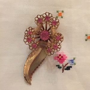 Vintage gold-tone pin with pink rhinestones